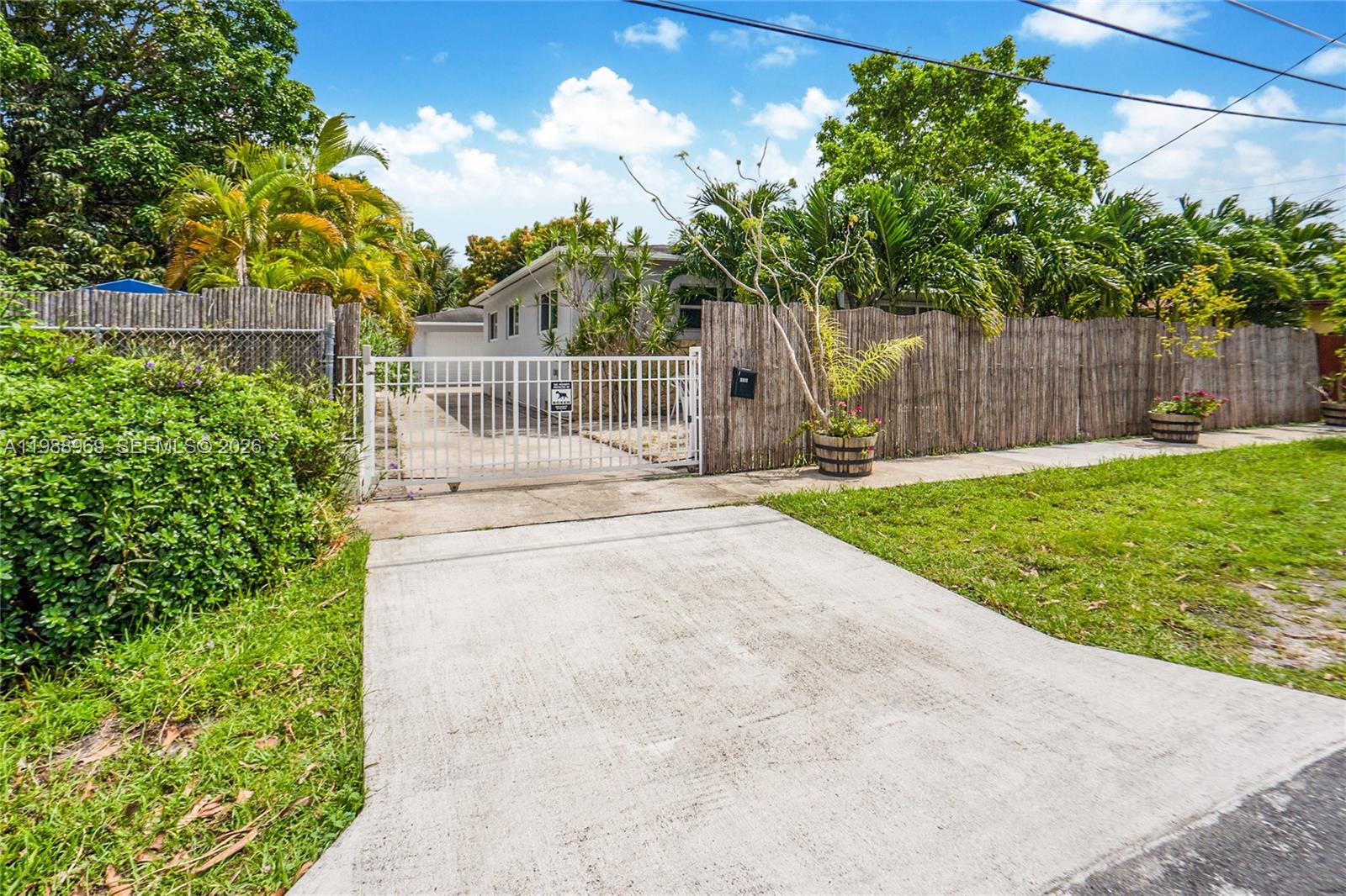 113 Southwest 2nd Street Hallandale Beach, FL 33009 - Photo 49 of 50 a view of a backyard with a garden