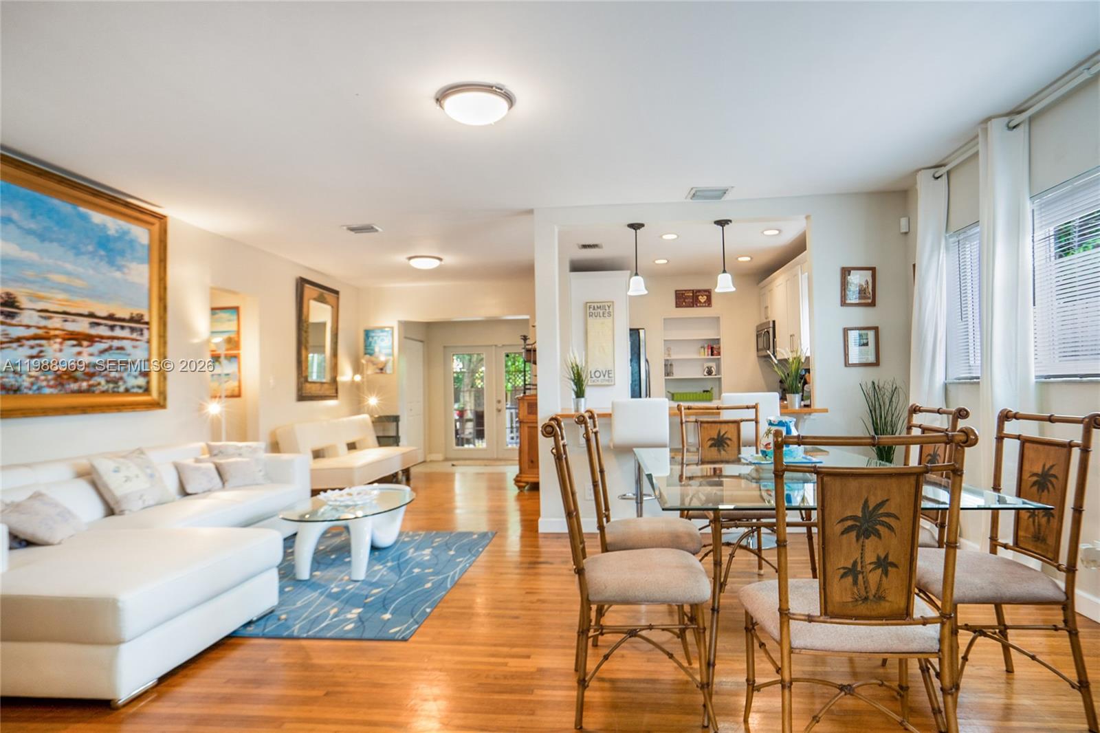 113 Southwest 2nd Street Hallandale Beach, FL 33009 - Photo 6 of 50 a living room with furniture wooden floor and a large window