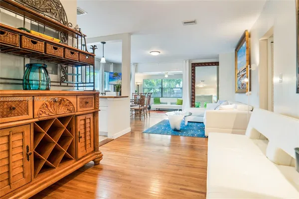 a kitchen with cabinets a sink and appliances