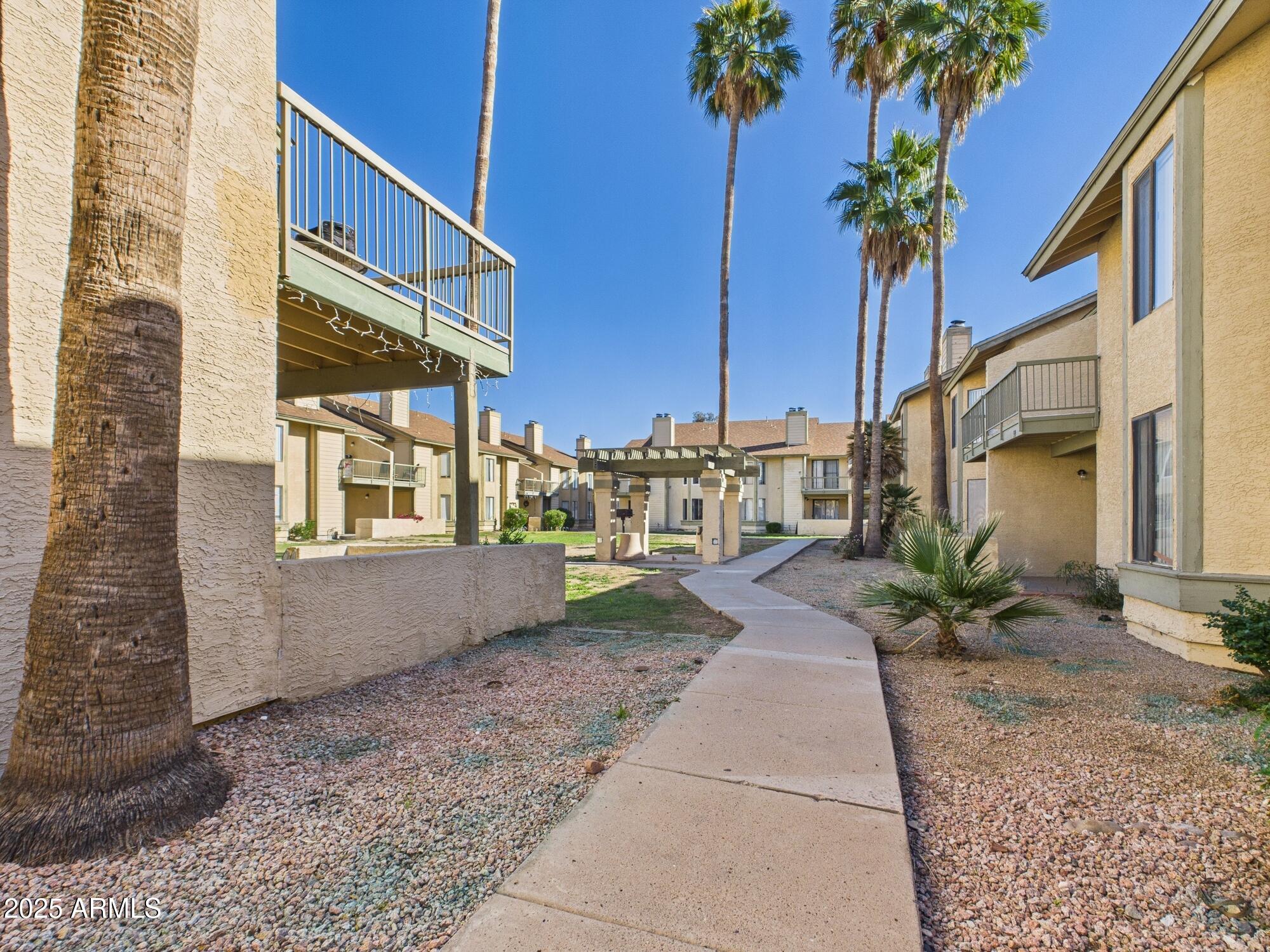 5236 West Peoria Avenue, Unit 140 Glendale, AZ 85302 - Photo 10 of 11 a view of a house with a yard