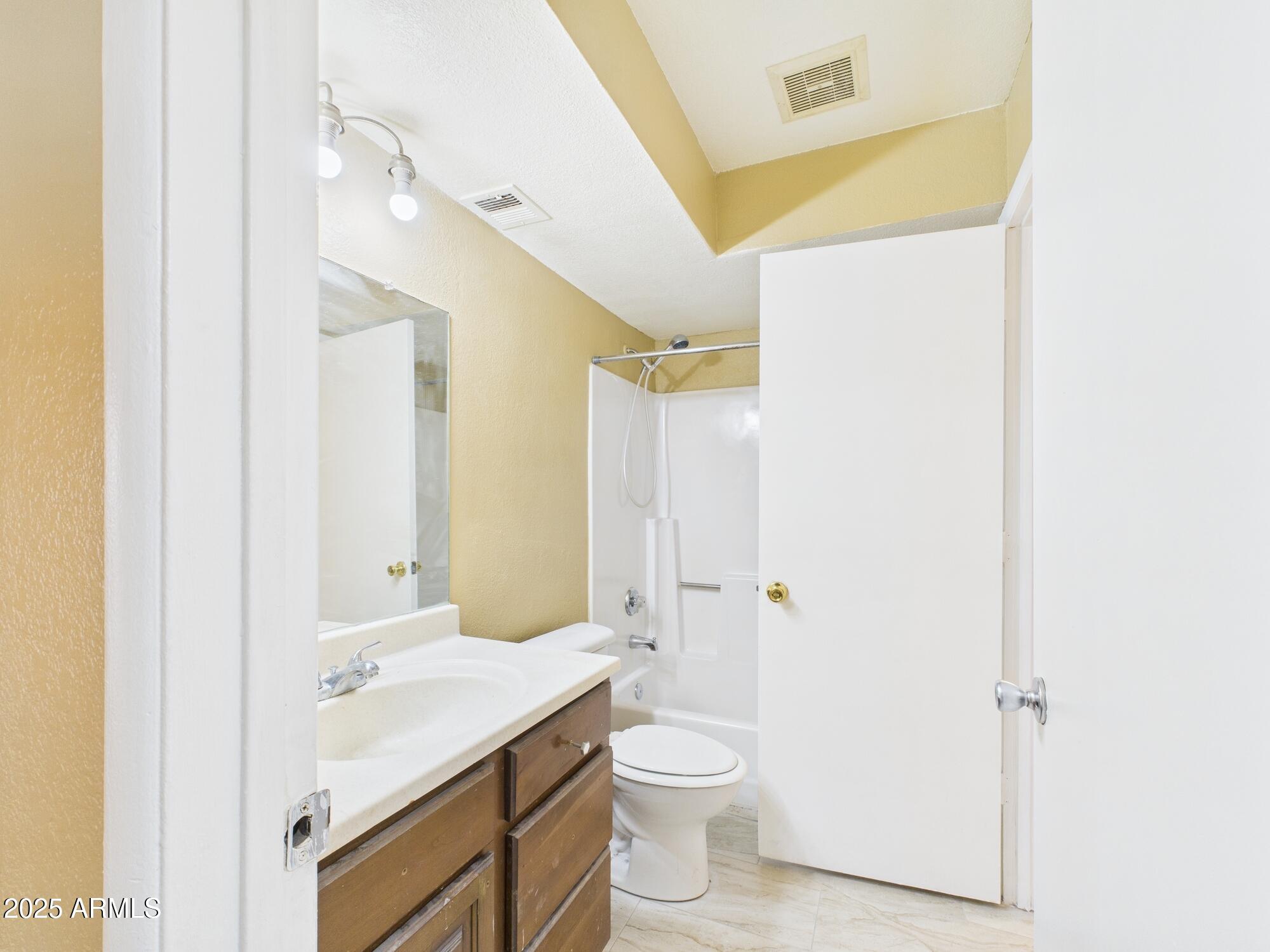 5236 West Peoria Avenue, Unit 140 Glendale, AZ 85302 - Photo 8 of 11 a bathroom with a sink a toilet and shower