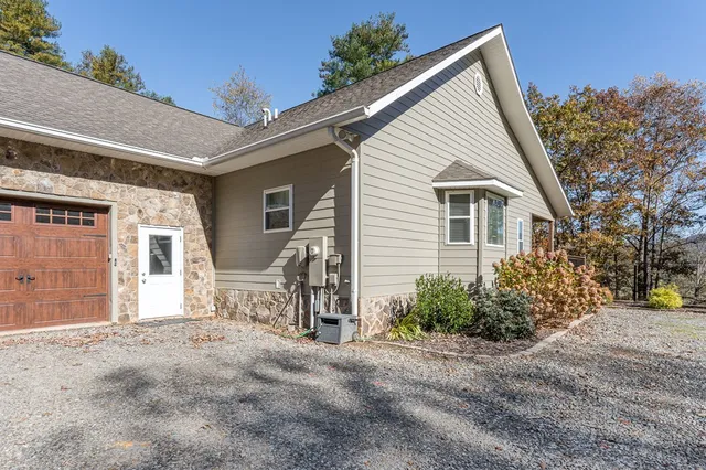 a view of a house with a backyard