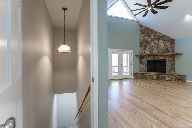 a view of a room with wooden floor