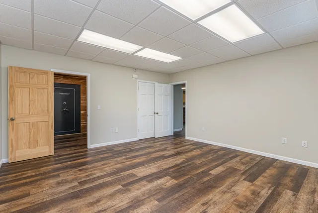 a view of a yard with large trees