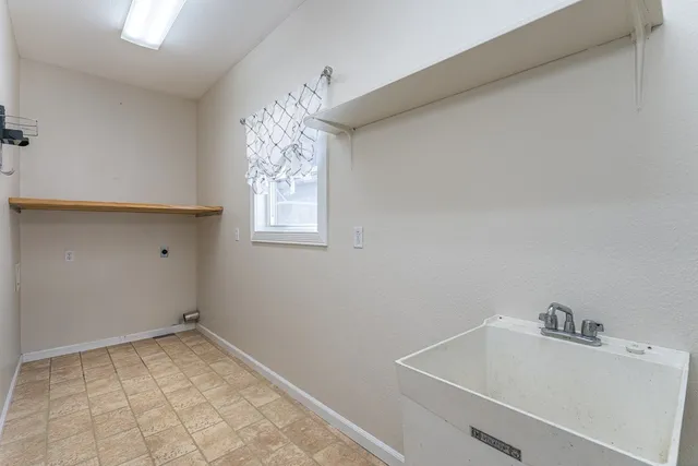 a view of utility room with window