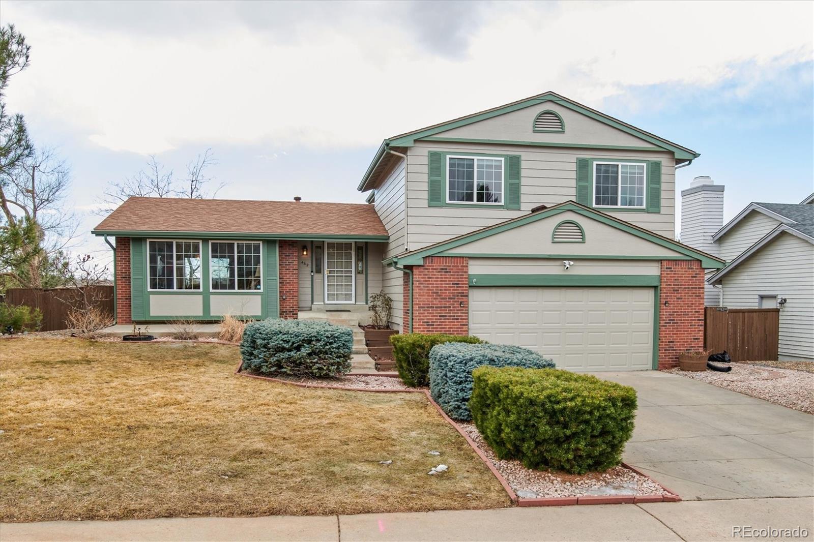 462 Northridge Road Highlands Ranch, CO 80126 - Photo 1 of 36 a front view of a house with a yard