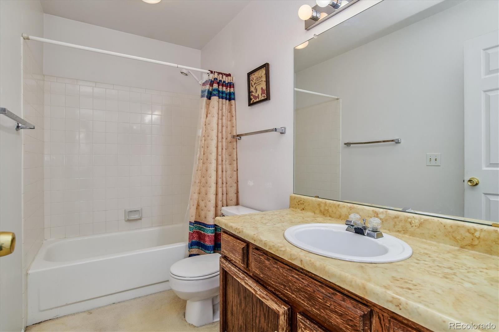 462 Northridge Road Highlands Ranch, CO 80126 - Photo 23 of 36 a bathroom with a sink a toilet and a bathtub