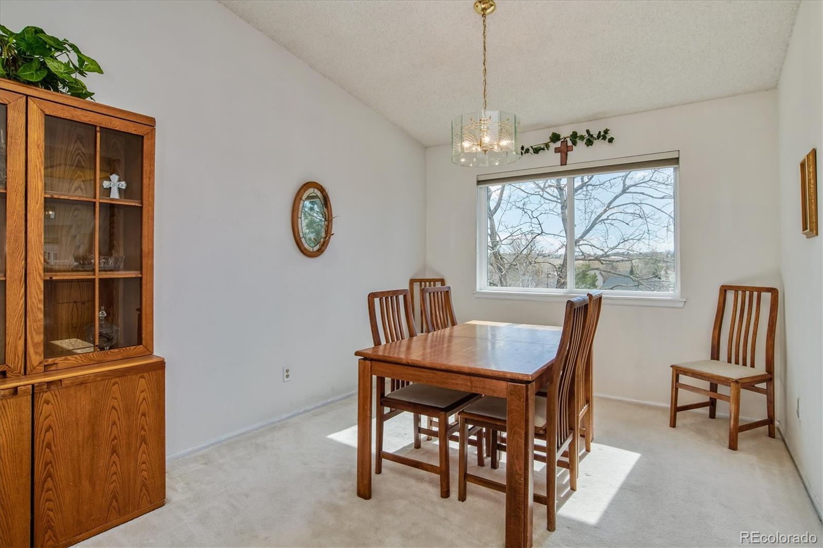 462 Northridge Road Highlands Ranch, CO 80126 - Photo 5 of 36 a view of a dining room with furniture window and outside view