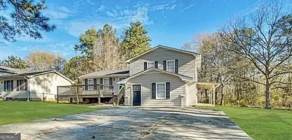 8347 Union Grove Road Lithonia, GA 30058 - Photo 1 of 9 a front view of a house with a garden