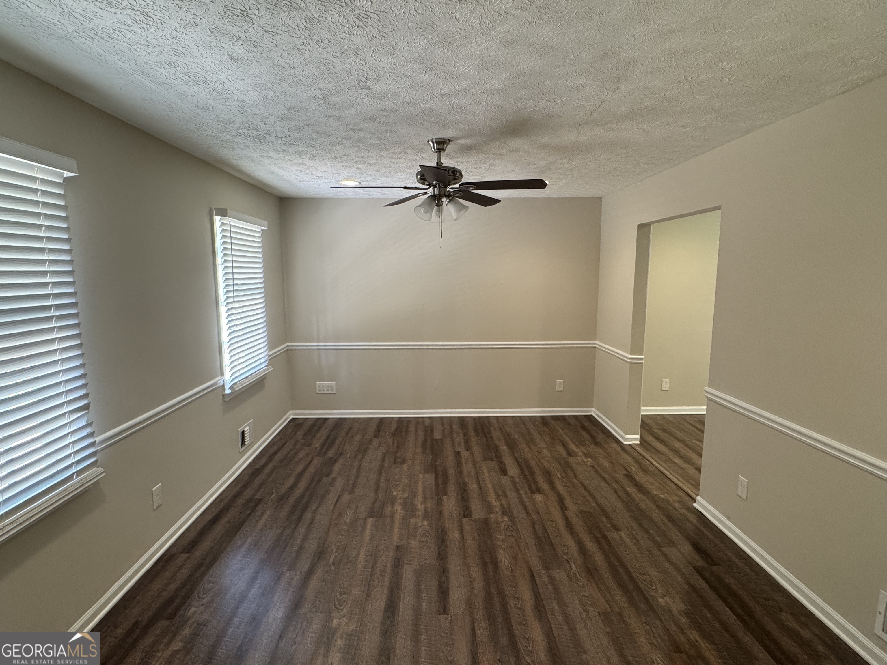 8347 Union Grove Road Lithonia, GA 30058 - Photo 4 of 9 wooden floor in an empty room with a window