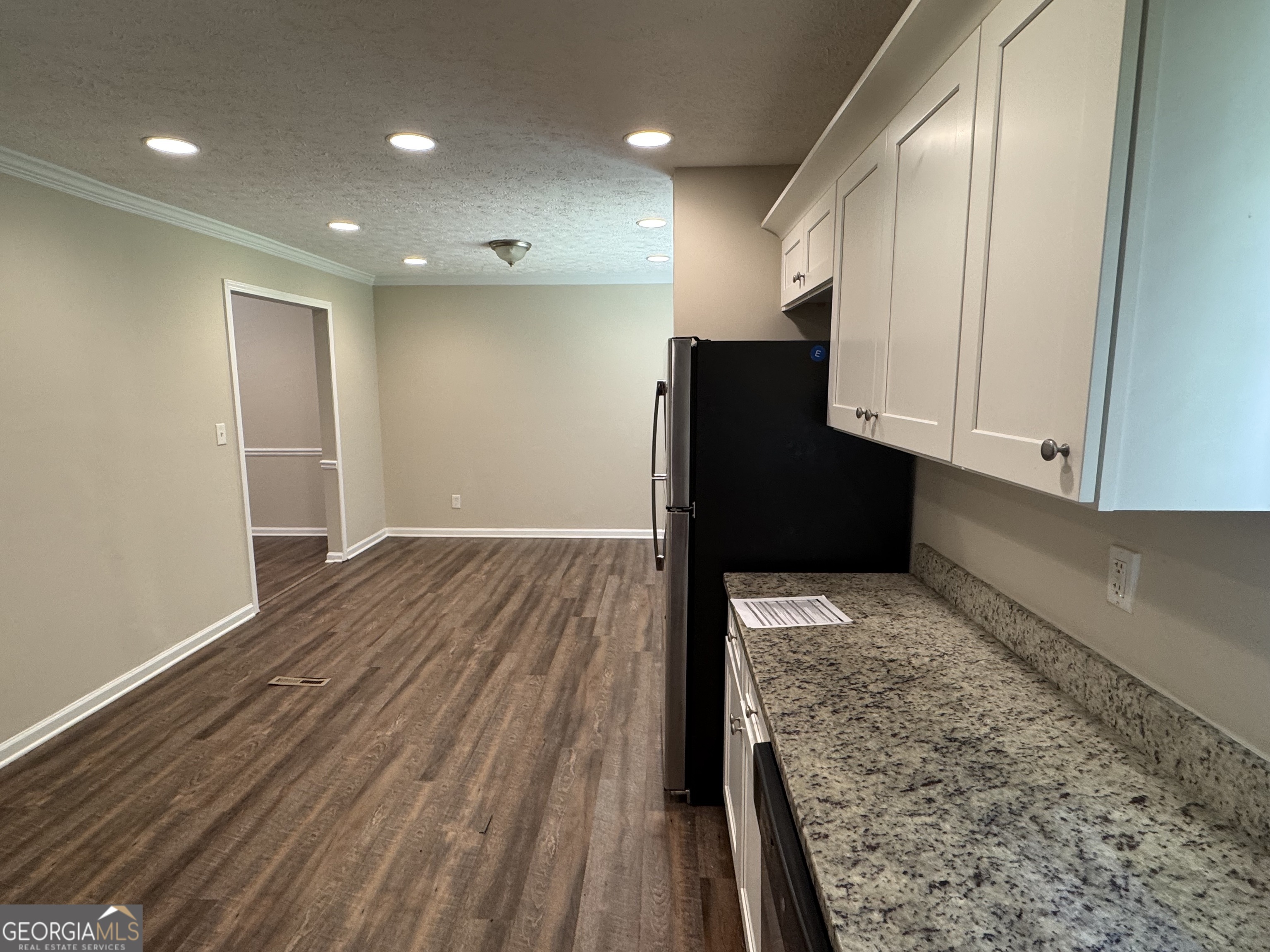 8347 Union Grove Road Lithonia, GA 30058 - Photo 5 of 9 a view of a hallway with wooden floor