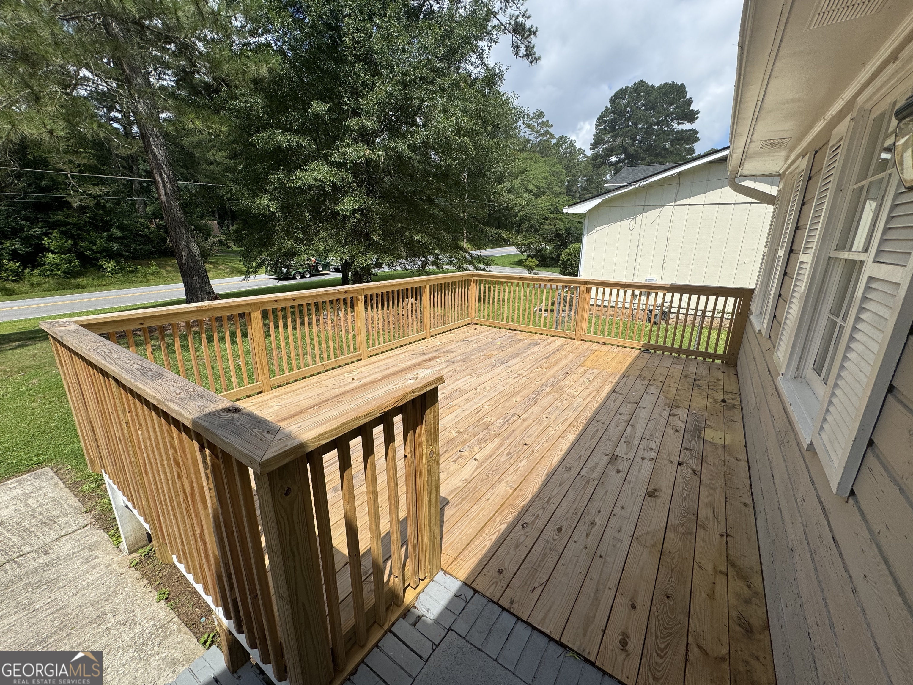 8347 Union Grove Road Lithonia, GA 30058 - Photo 9 of 9 a view of balcony with wooden floor and fence