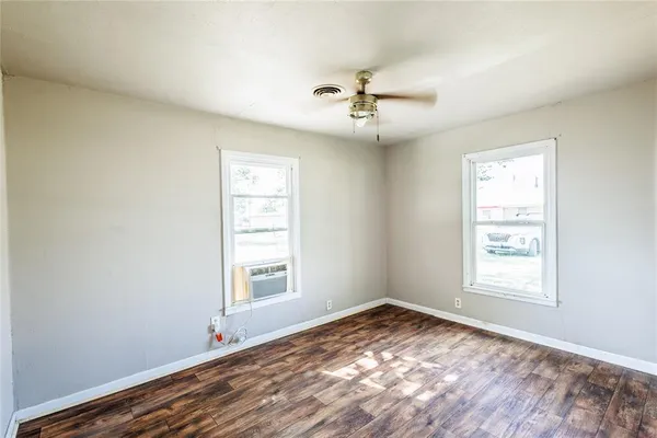 a view of empty room with windows