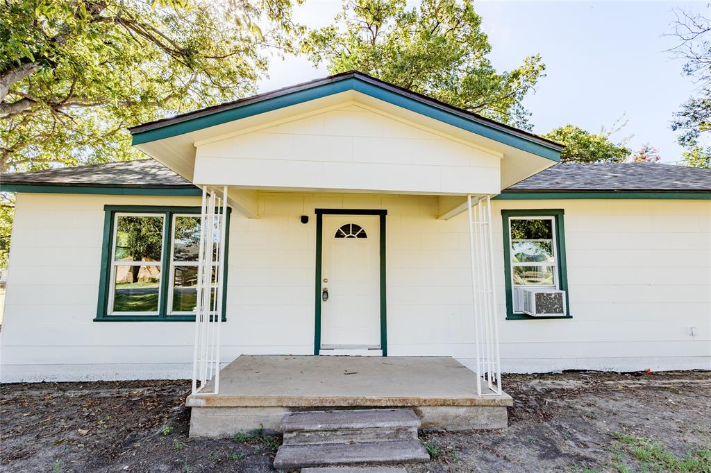 202 North Sycamore Malone, TX 76660 - Photo 2 of 22 a front view of a house with windows