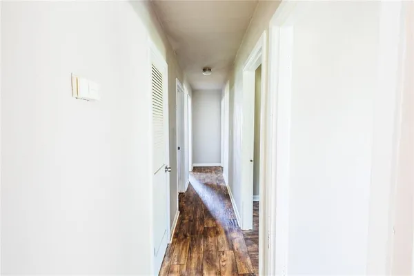 a view of a hallway with a white walls