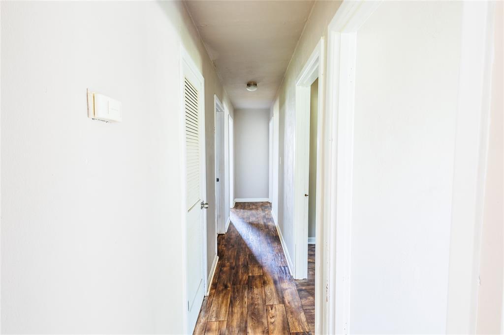 202 North Sycamore Malone, TX 76660 - Photo 9 of 22 a view of a hallway with a white walls
