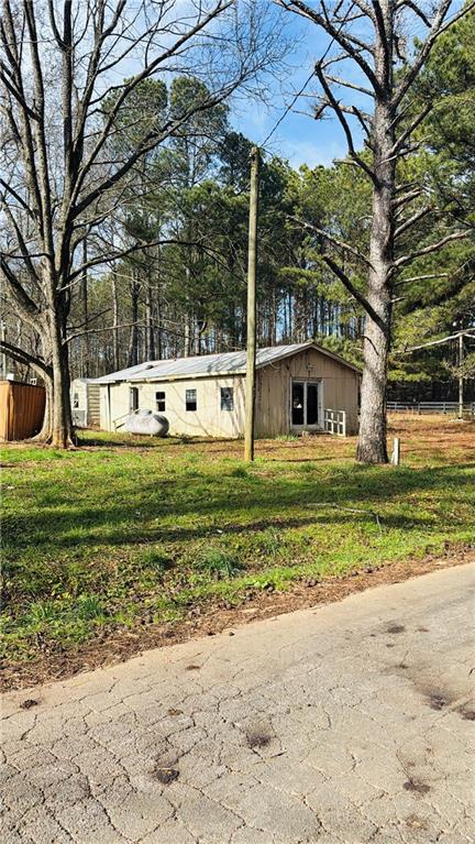 508 McKibben Road Buchanan, GA 30113 - Photo 2 of 13 a view of a house with a yard