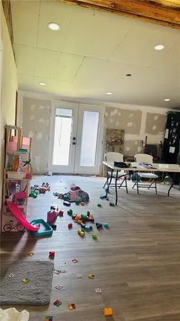 a room with furniture and a wooden floor