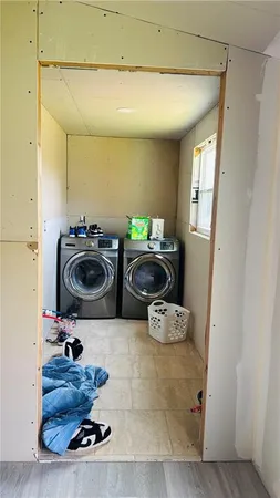 a room with gym equipment and a rug