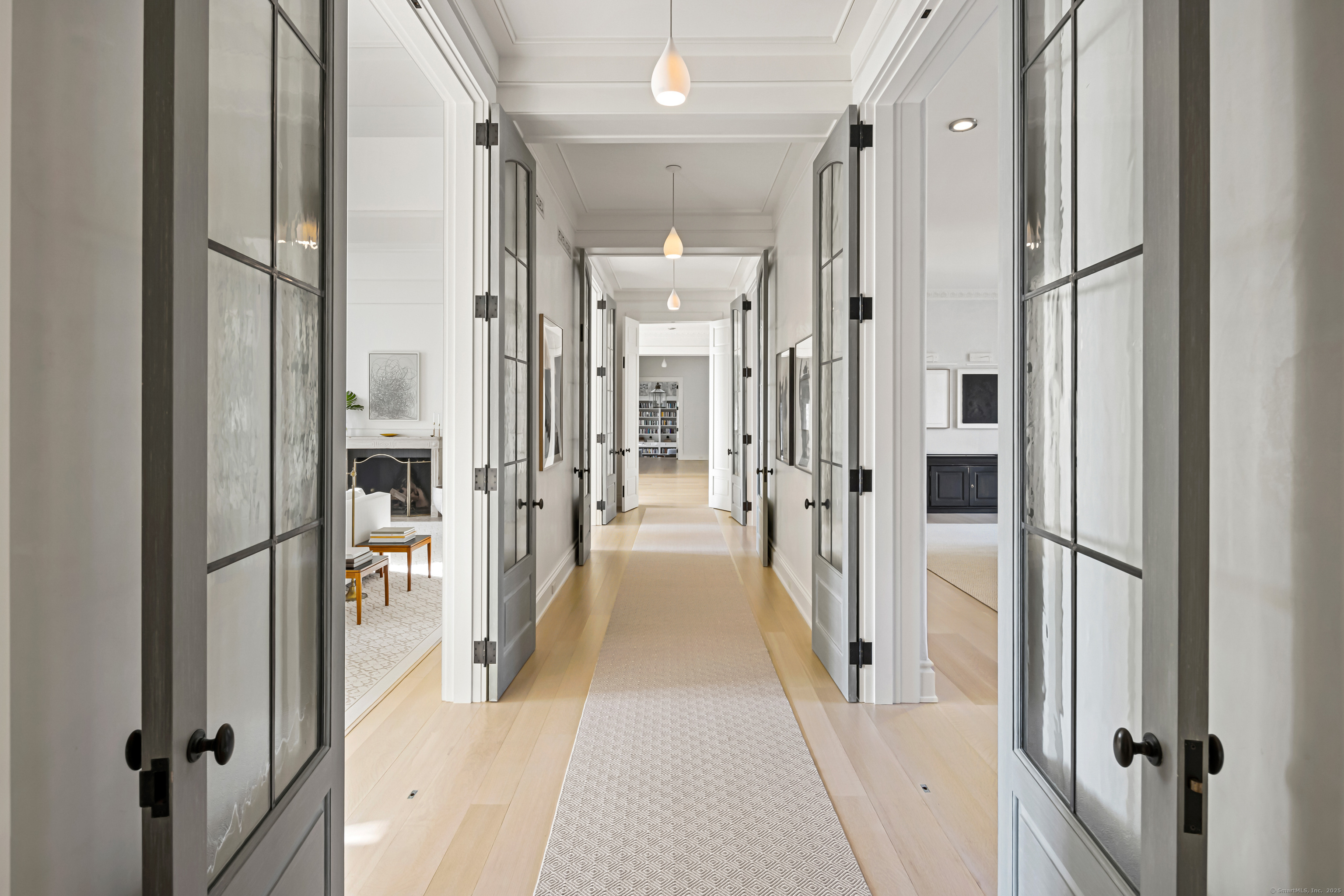 1131 Sasco Hill Road Fairfield, CT 06824 - Photo 15 of 40 a view of a hallway with a glass door and furniture