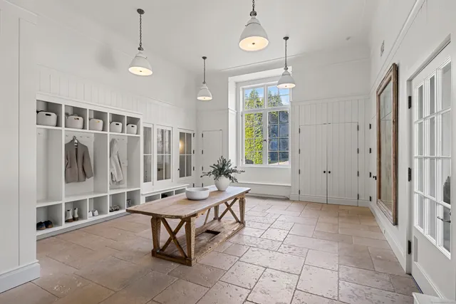 a living room with patio furniture and a window