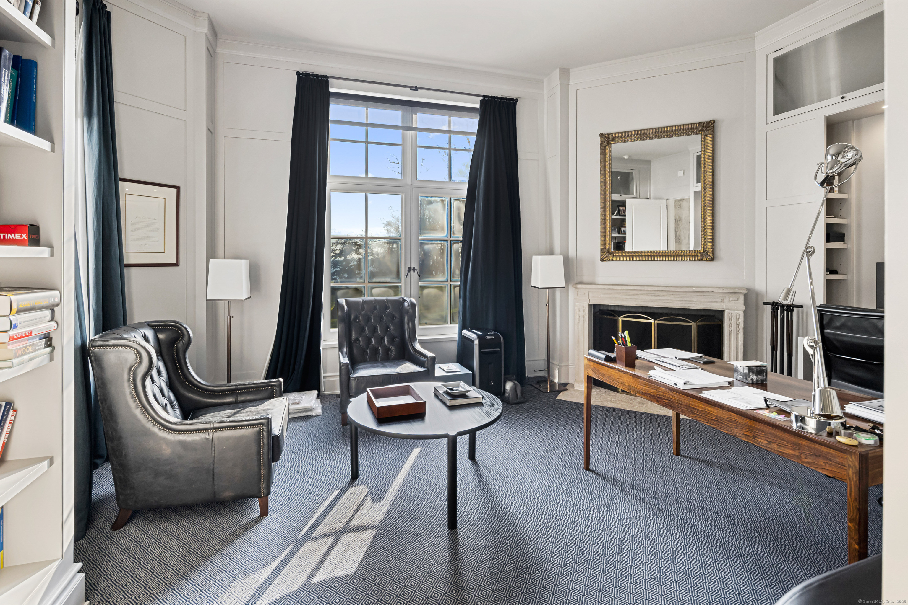1131 Sasco Hill Road Fairfield, CT 06824 - Photo 19 of 40 a living room with furniture a rug and a fireplace
