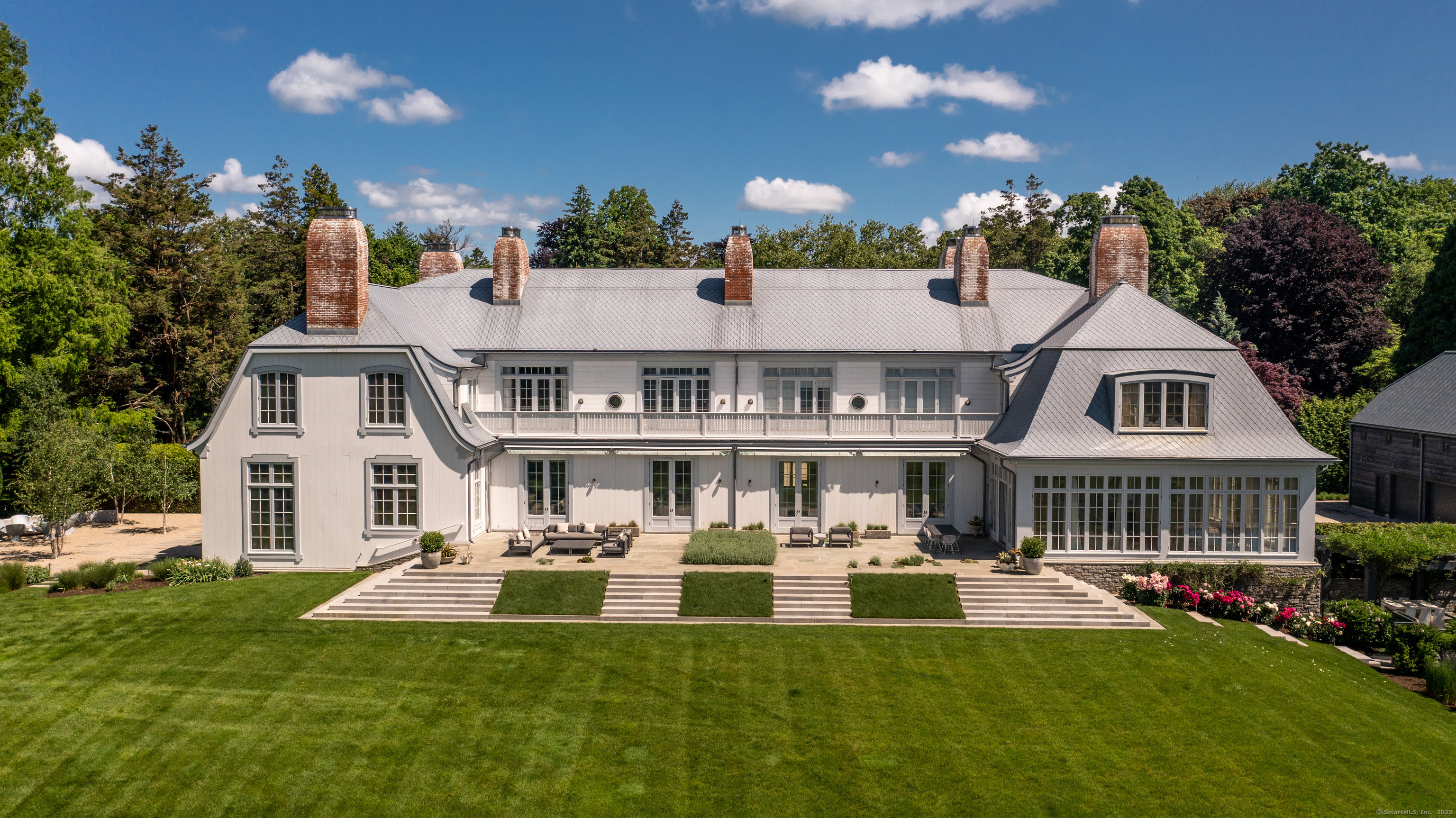 1131 Sasco Hill Road Fairfield, CT 06824 - Photo 2 of 40 a front view of residential houses with yard and green space