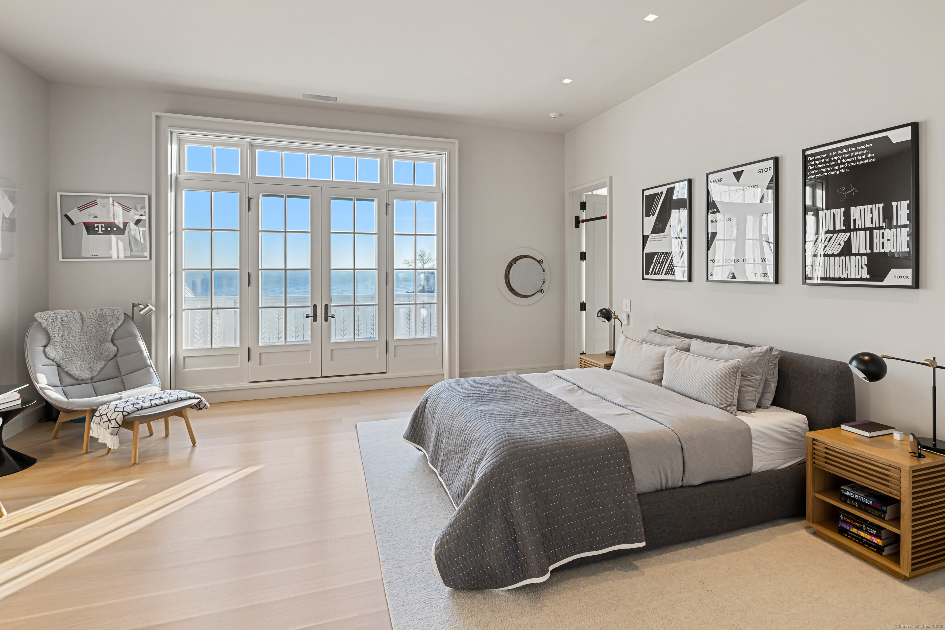 1131 Sasco Hill Road Fairfield, CT 06824 - Photo 27 of 40 a bedroom with a bed and wooden floor