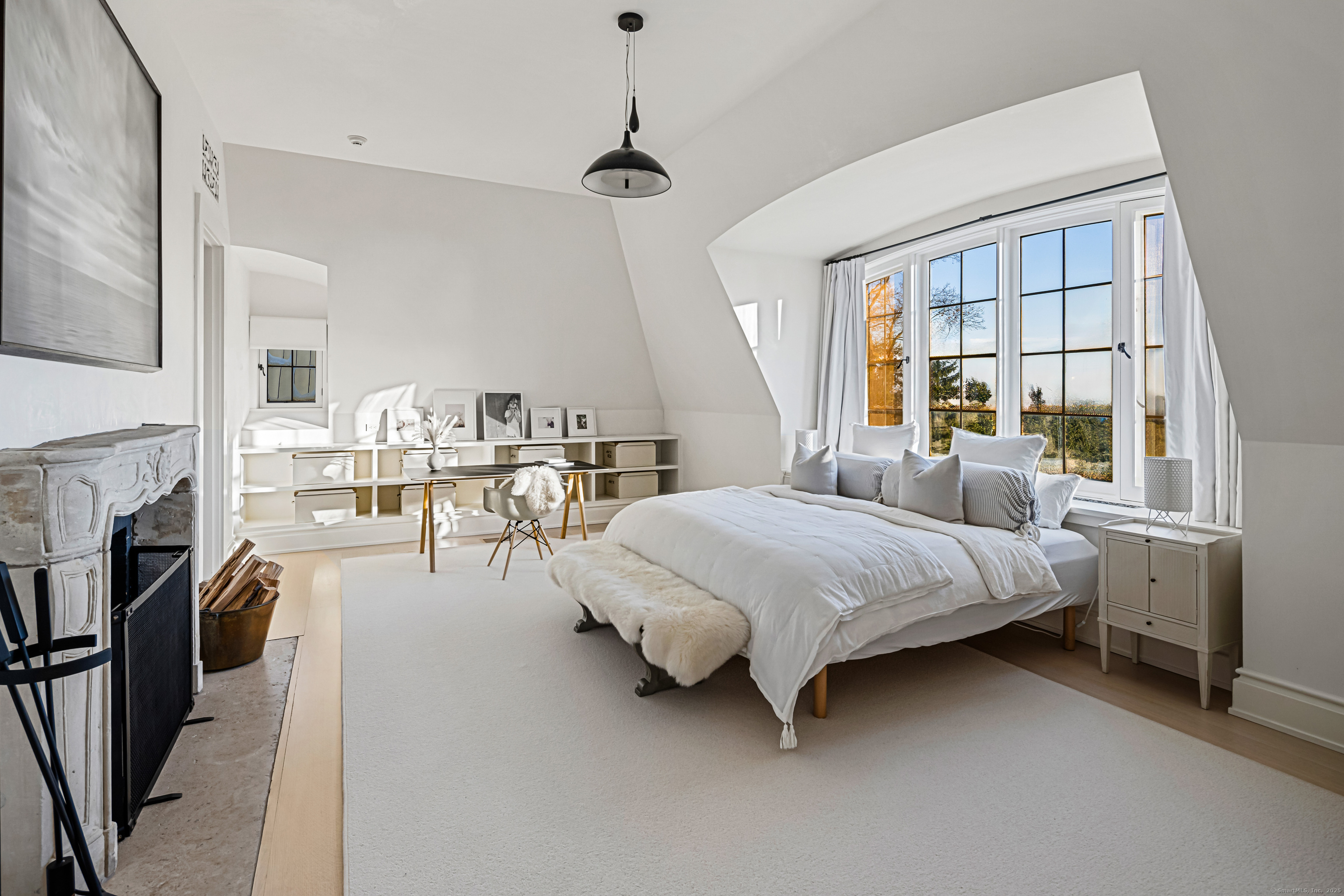 1131 Sasco Hill Road Fairfield, CT 06824 - Photo 30 of 40 a spacious bedroom with a bed couch and a window