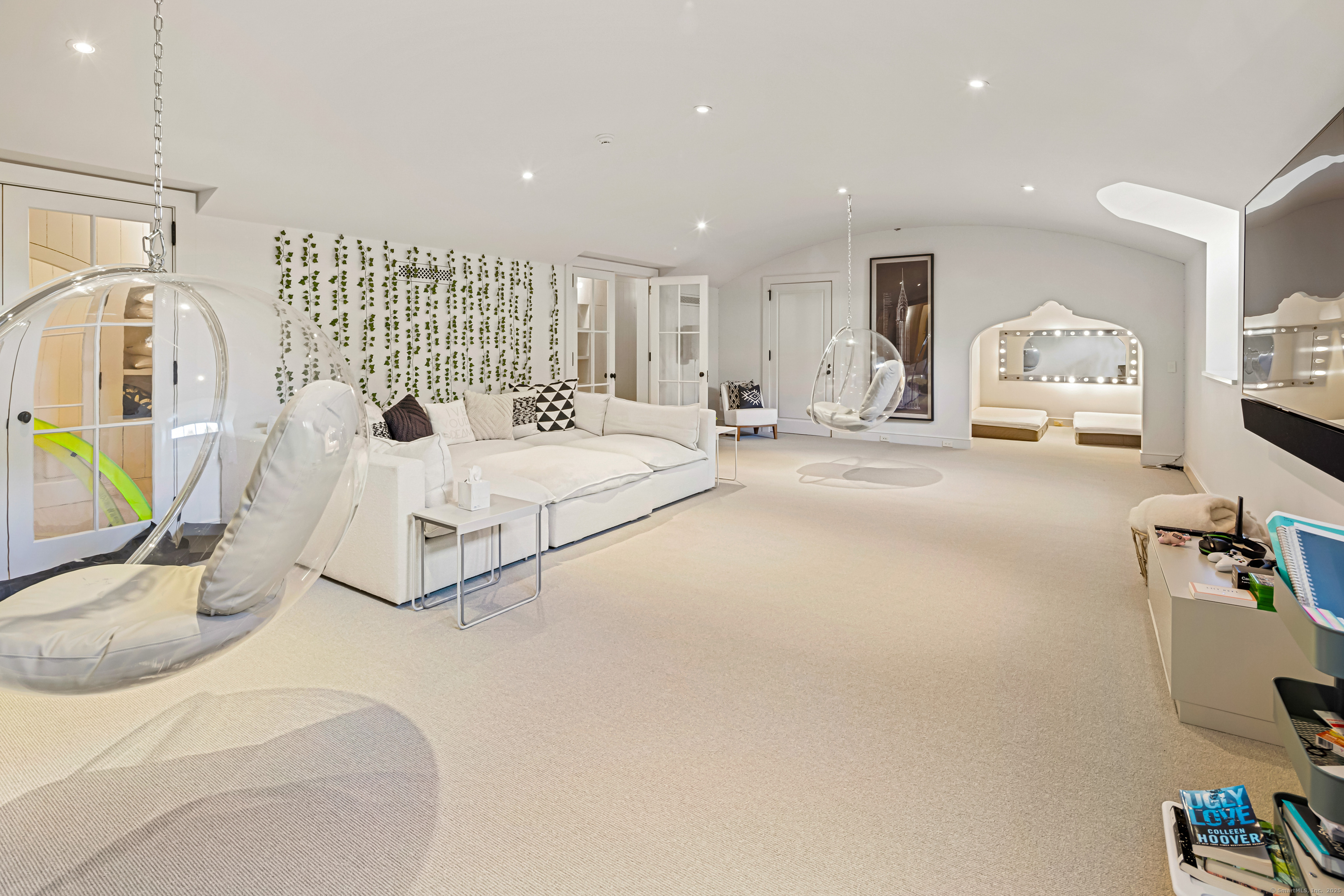 1131 Sasco Hill Road Fairfield, CT 06824 - Photo 33 of 40 a spacious bedroom with a bed a couch and dresser