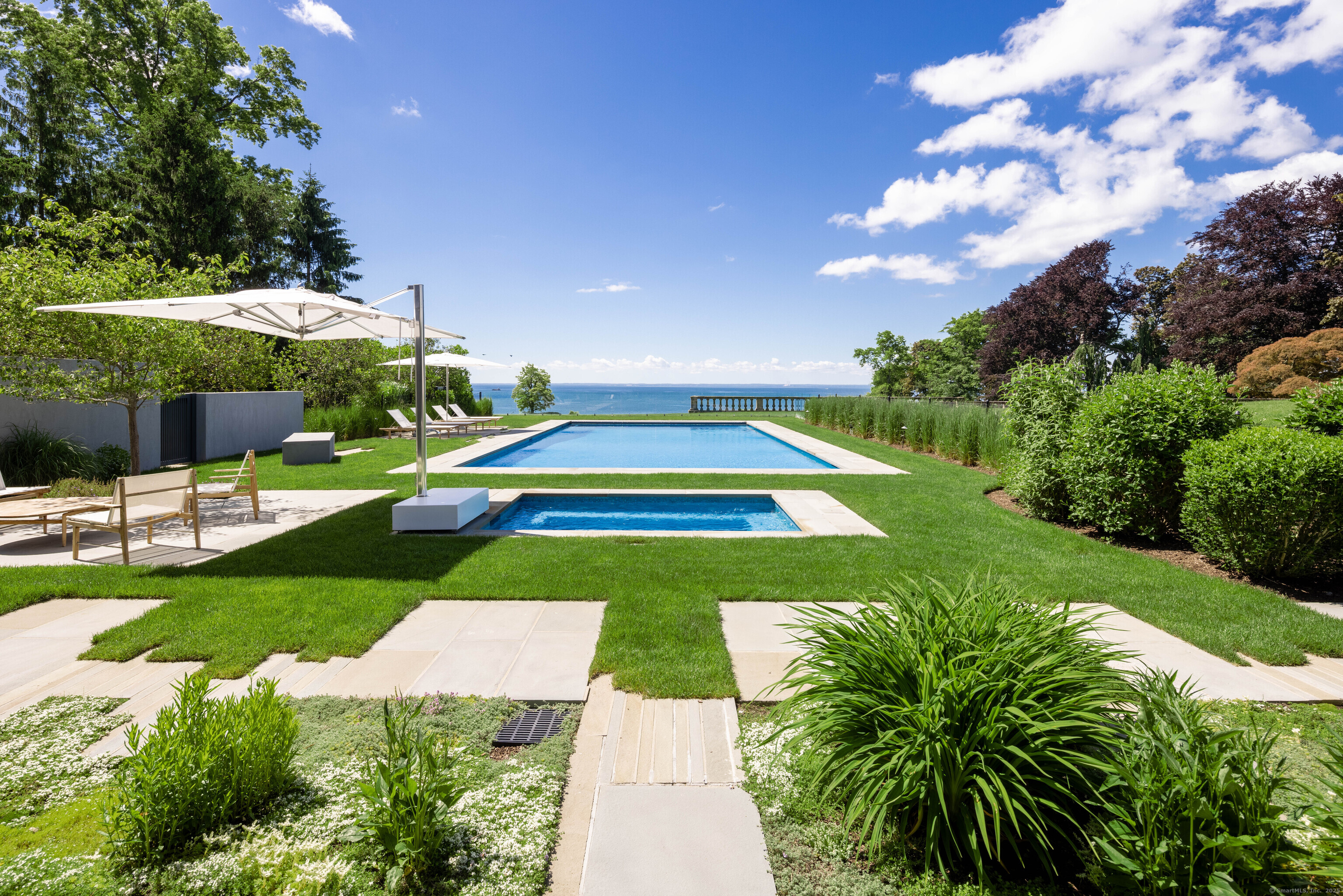 1131 Sasco Hill Road Fairfield, CT 06824 - Photo 38 of 40 a view of a backyard with swimming pool