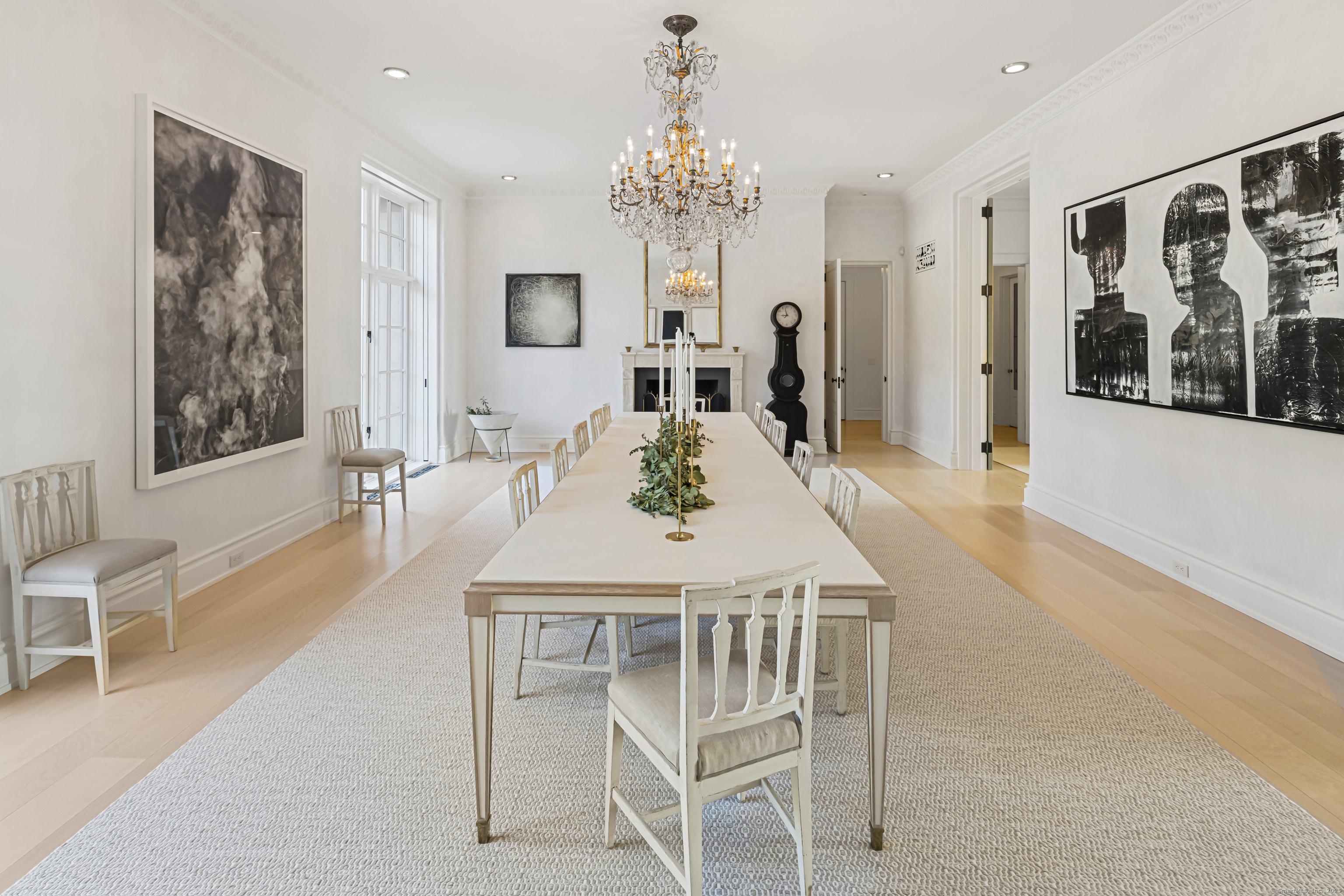 1131 Sasco Hill Road Fairfield, CT 06824 - Photo 10 of 40 a view of a dining room with furniture and chandelier