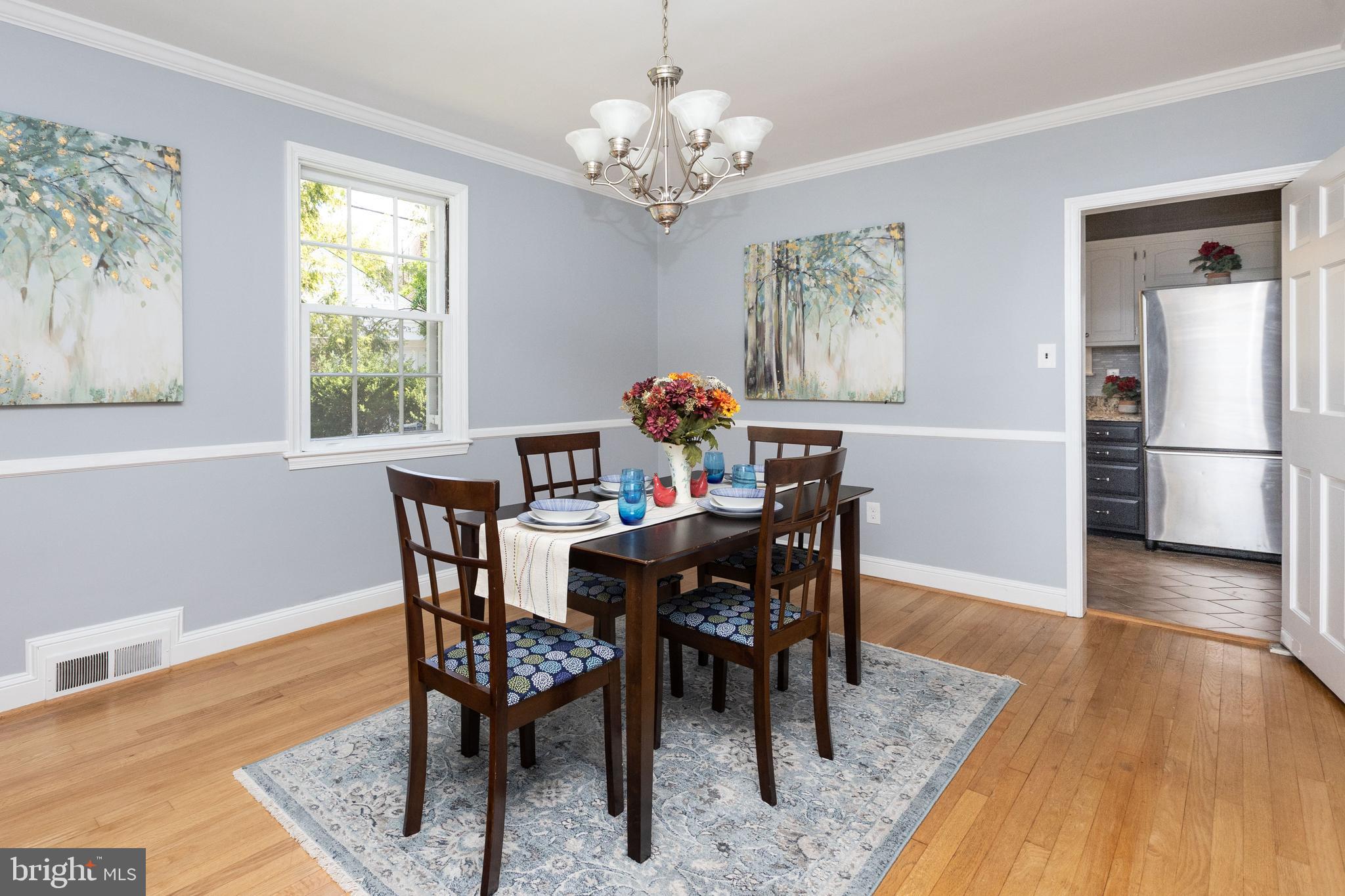 5507 Springlake Way Baltimore, MD 21212 - Photo 8 of 46 Dining room w/ chair rail and crown moulding
