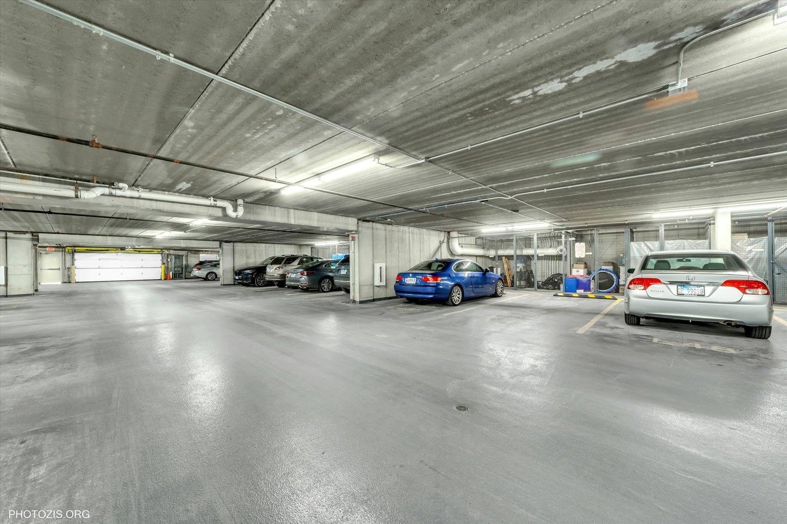 1199 East Port Clinton Road, Unit 201 Vernon Hills, IL 60061 - Photo 14 of 19 a view of parking space with parked cars