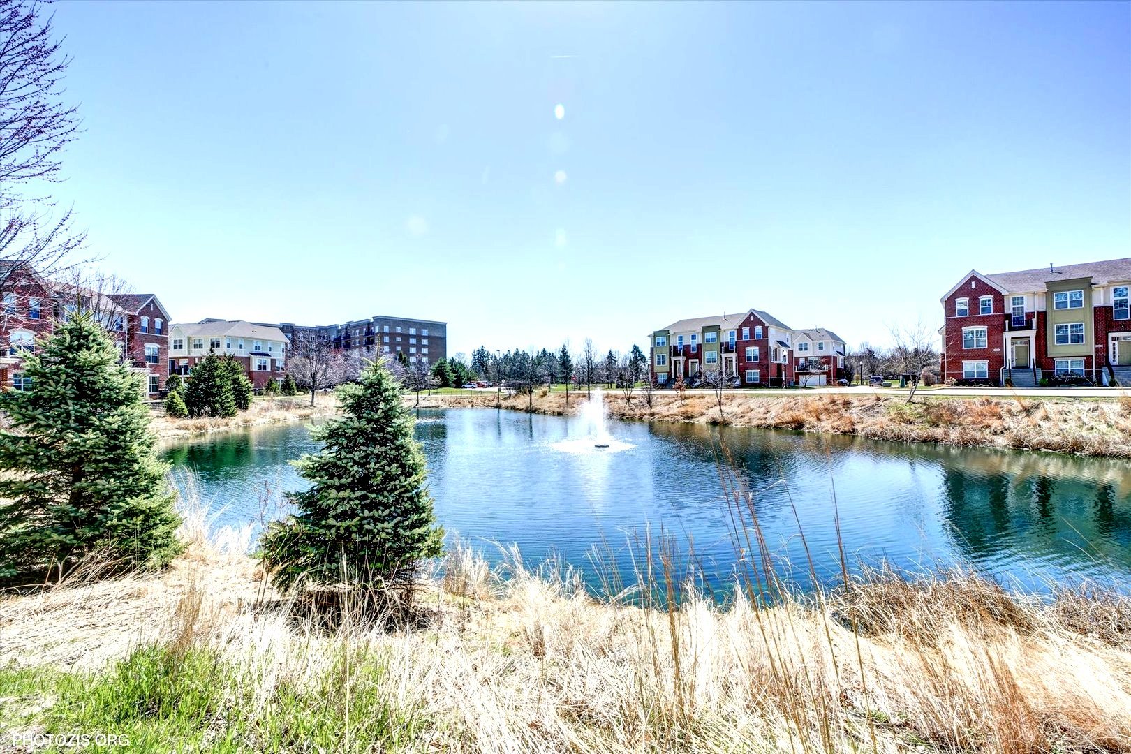 1199 East Port Clinton Road, Unit 201 Vernon Hills, IL 60061 - Photo 15 of 19 a view of a lake with houses