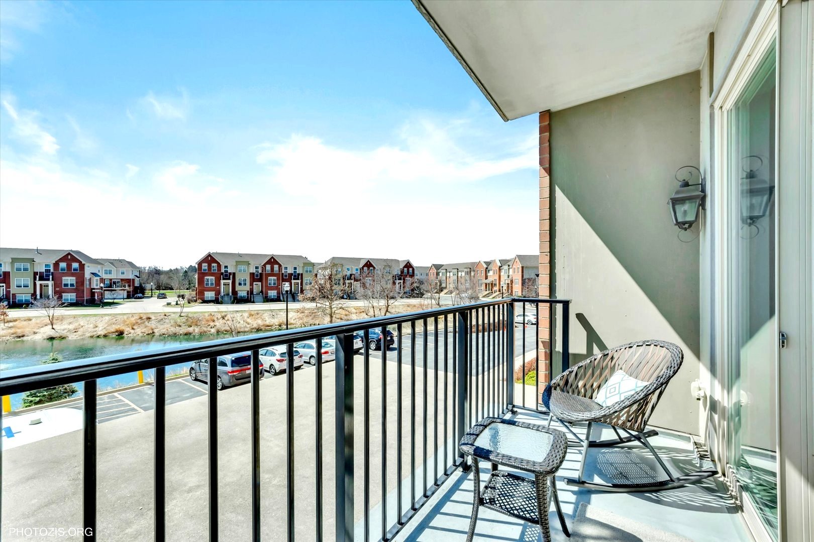 1199 East Port Clinton Road, Unit 201 Vernon Hills, IL 60061 - Photo 10 of 19 a view of a balcony with chairs and wooden fence