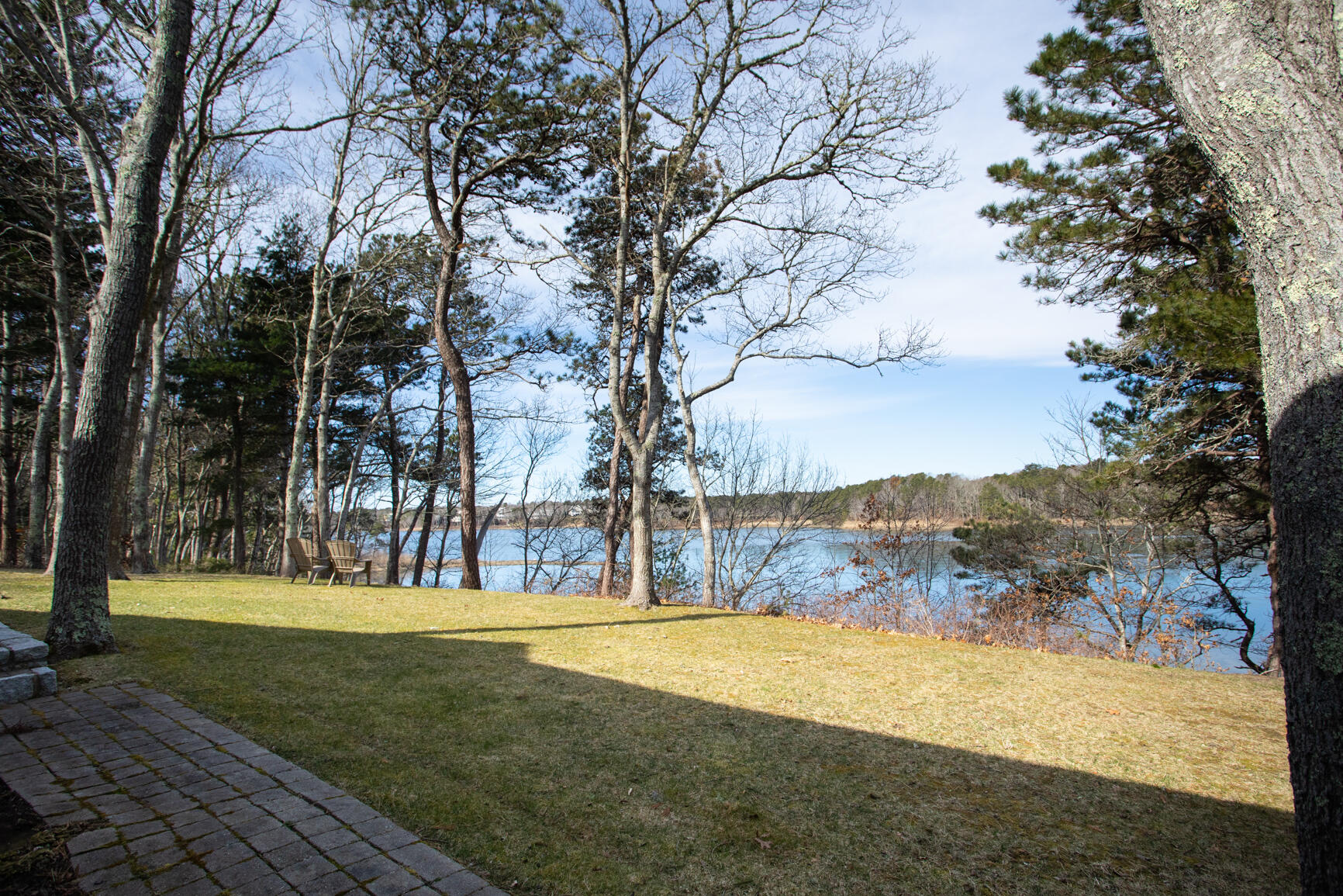 40 Bay Road Cotuit, MA 02635 - Photo 1 of 27 a view of swimming pool with large trees and a big yard