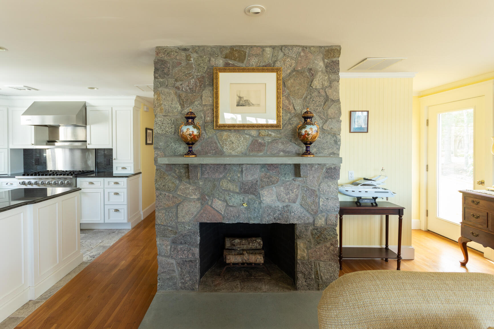 40 Bay Road Cotuit, MA 02635 - Photo 13 of 27 a living room with furniture and a fireplace