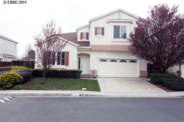 731 Edward Werth Drive Rodeo, CA 94572 - Photo 1 of 1 a white house that has a tree in front of it