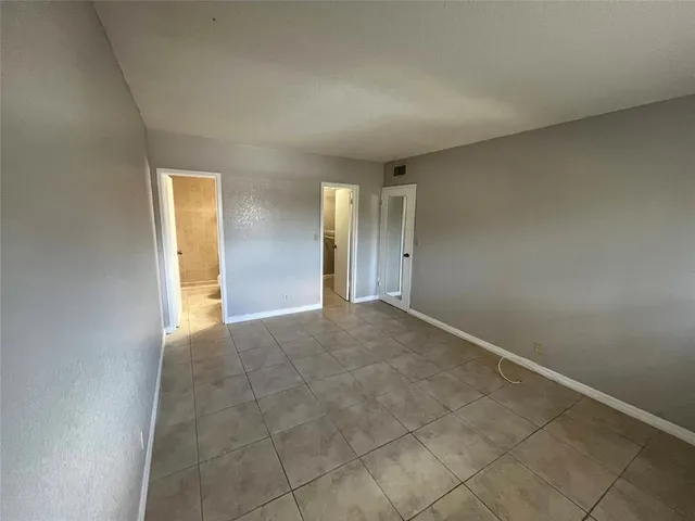 an empty room with a bathroom