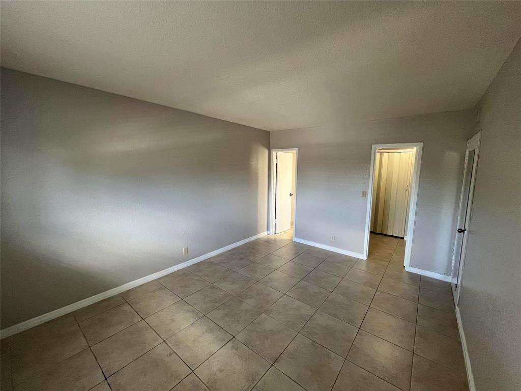 2020 Northeast 56th Street, Unit 208 Fort Lauderdale, FL 33308 - Photo 17 of 54 an empty room with a bathroom