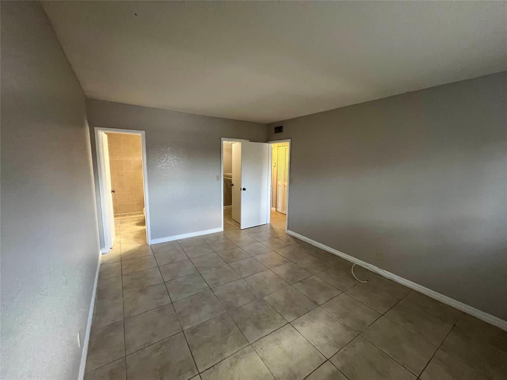 2020 Northeast 56th Street, Unit 208 Fort Lauderdale, FL 33308 - Photo 18 of 54 a view of an empty room with a window