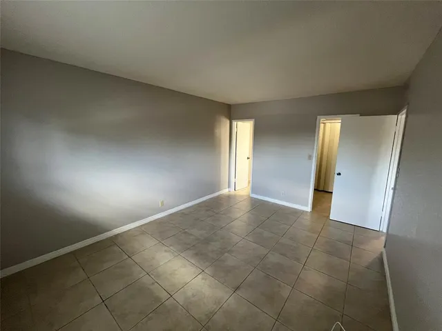 an empty room with a bathroom