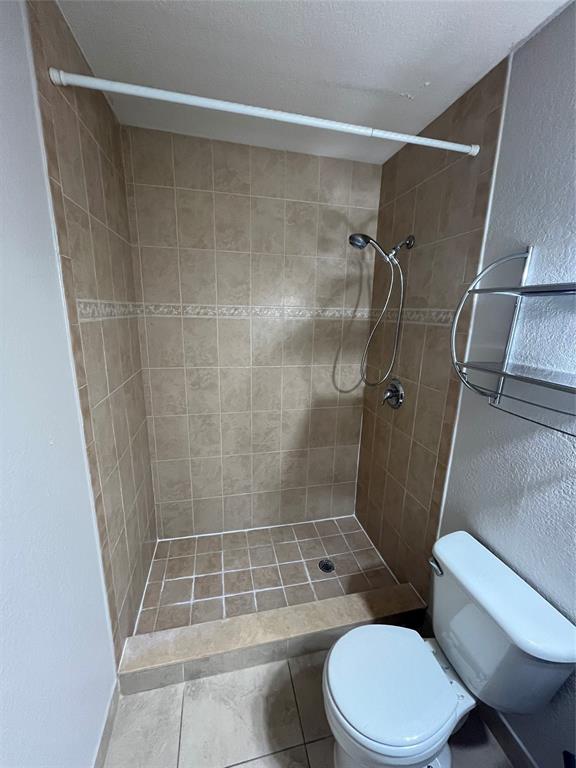 2020 Northeast 56th Street, Unit 208 Fort Lauderdale, FL 33308 - Photo 22 of 54 a bathroom with a toilet and a shower