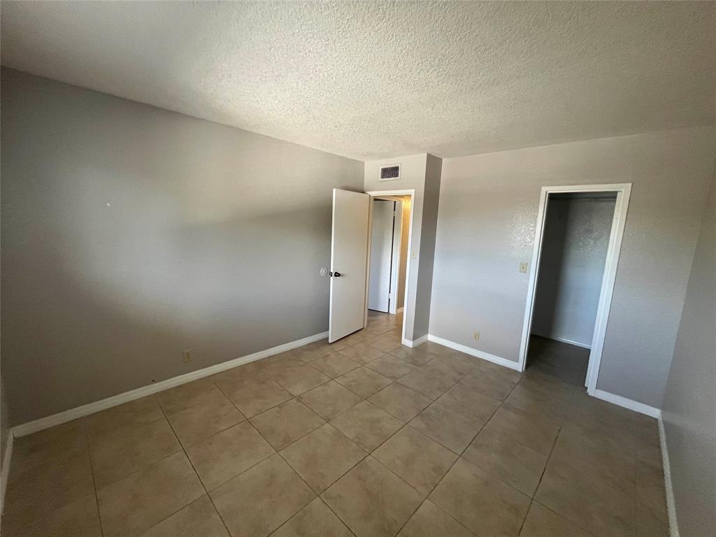 2020 Northeast 56th Street, Unit 208 Fort Lauderdale, FL 33308 - Photo 28 of 54 an empty room with window