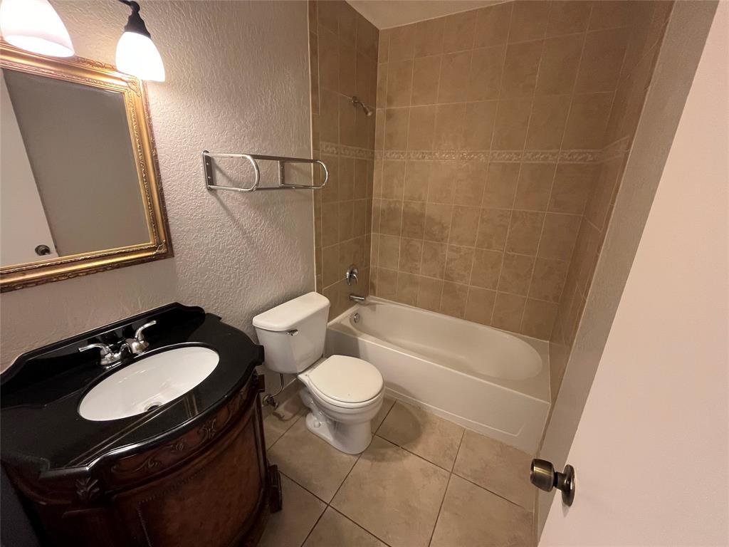 2020 Northeast 56th Street, Unit 208 Fort Lauderdale, FL 33308 - Photo 35 of 54 a bathroom with a sink toilet mirror and shower