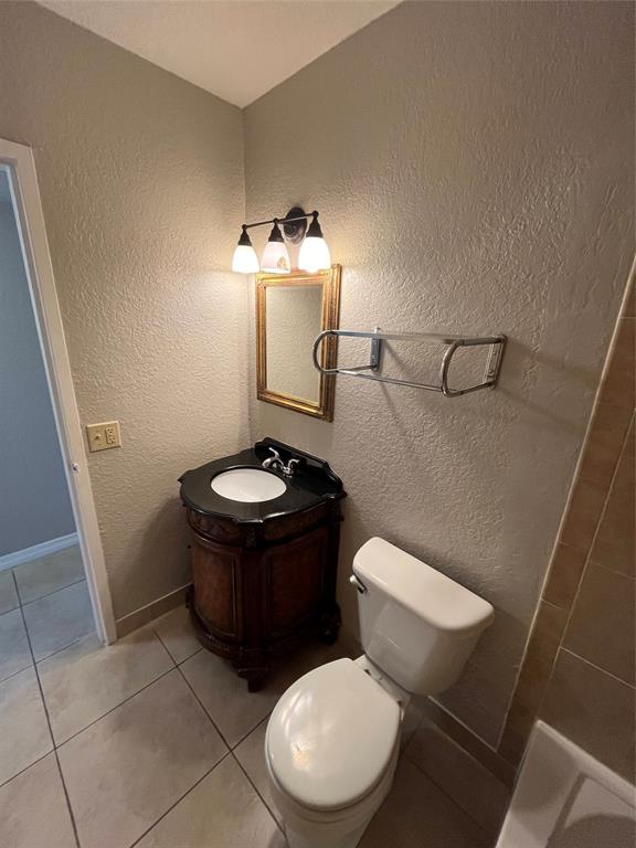 2020 Northeast 56th Street, Unit 208 Fort Lauderdale, FL 33308 - Photo 38 of 54 a bathroom with a toilet and a mirror