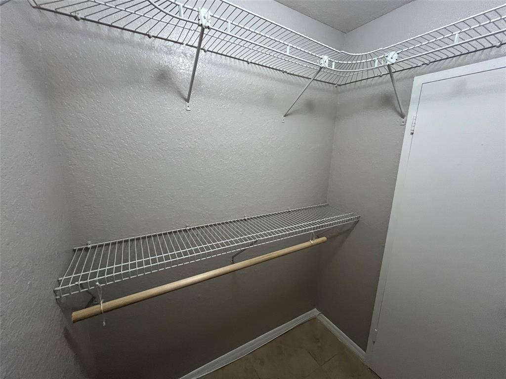 2020 Northeast 56th Street, Unit 208 Fort Lauderdale, FL 33308 - Photo 42 of 54 a view of a room with racks on the wall