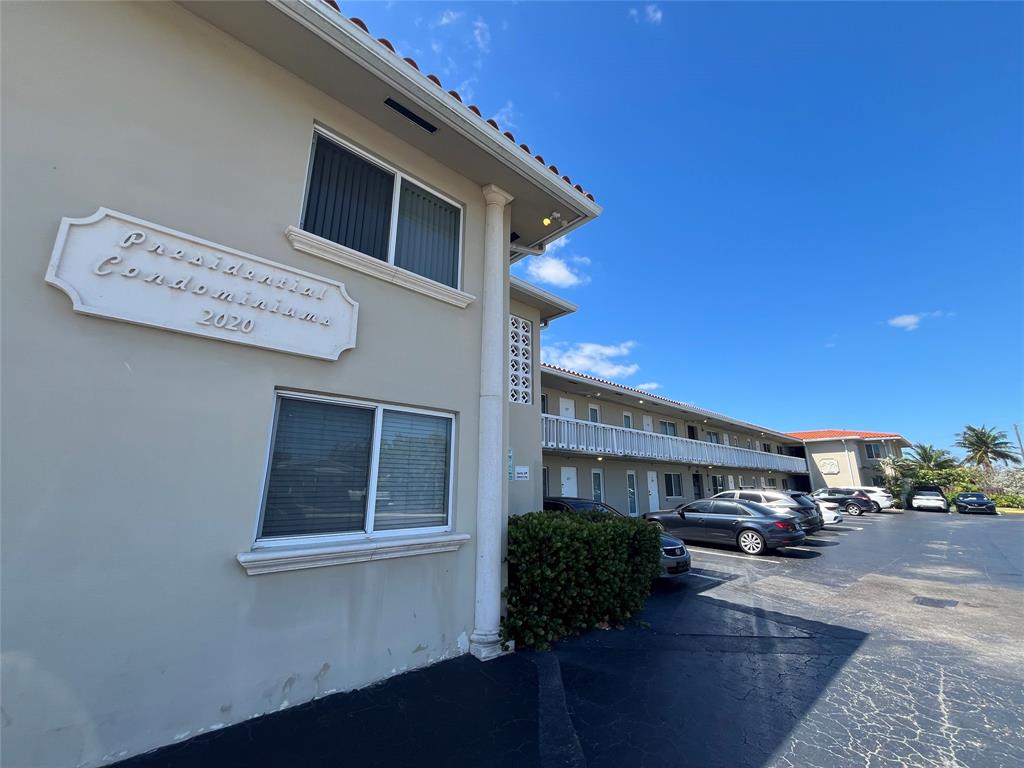 2020 Northeast 56th Street, Unit 208 Fort Lauderdale, FL 33308 - Photo 47 of 54 a front view of a house with yard