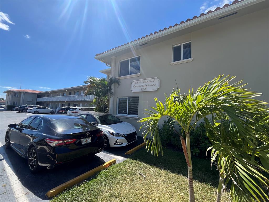 2020 Northeast 56th Street, Unit 208 Fort Lauderdale, FL 33308 - Photo 49 of 54 a car parked in front of a house